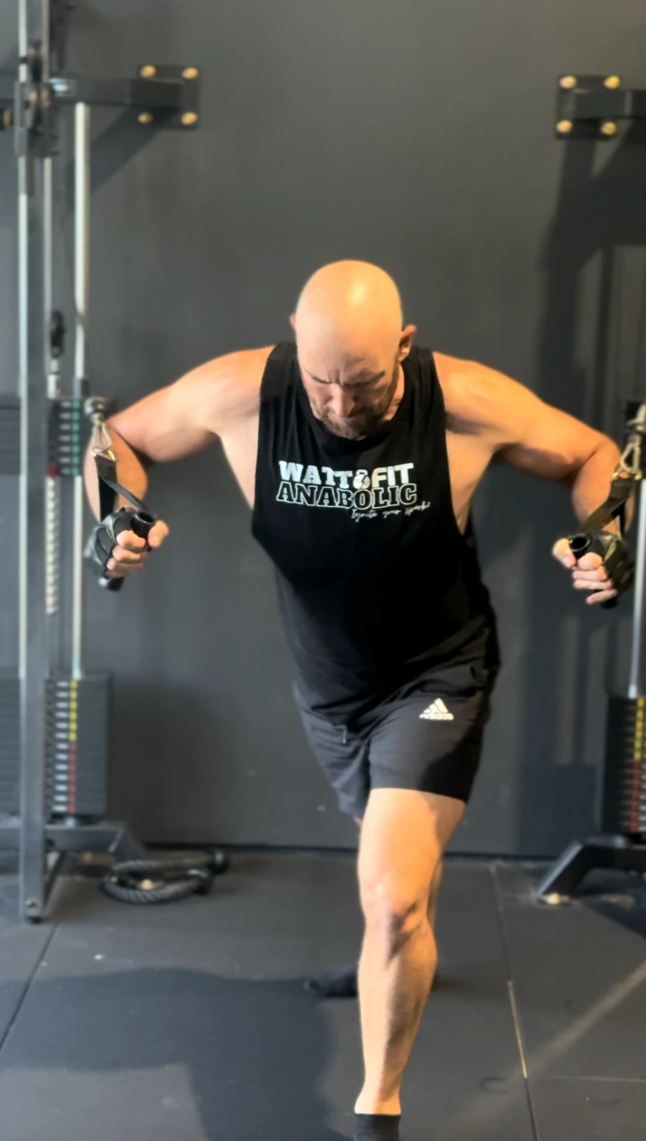 Man doing cable chest flys as part of a semi private session
